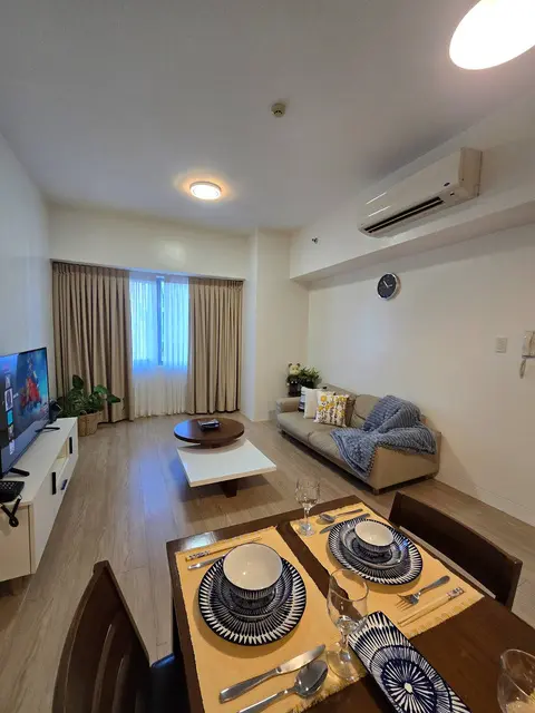 Living and dining area after full renovation at The Infinity Condominium, BGC