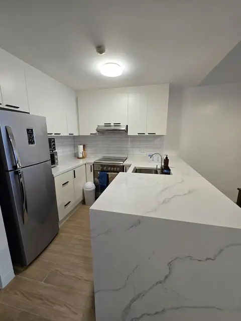 Renovated kitchen with new counters and finishes at The Infinity Condominium